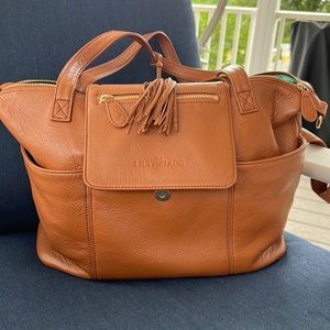 Only used a few times. This bag is real leather!